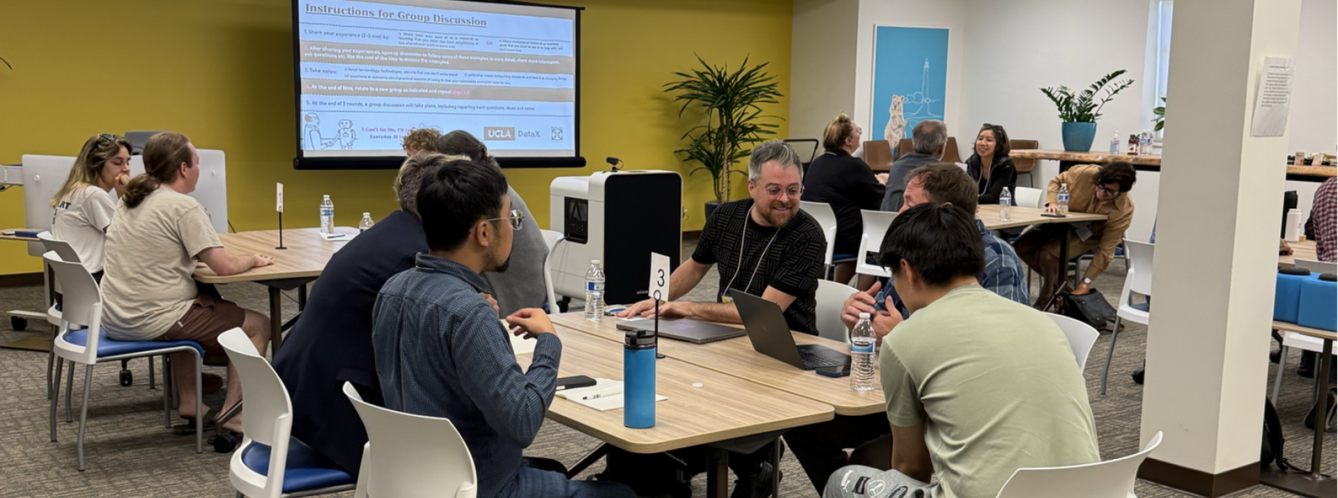 Group of people discussing in DataX Impact Forum for Livescu event