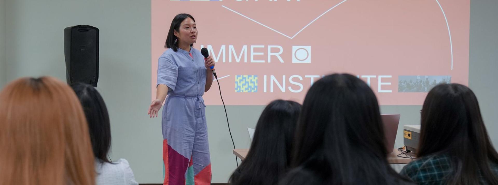 Instructor speaking at AI Code and Art Summer Institute.jpeg