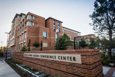 Brick building displaying Meyer and Renee Luskin Conference Center entrance sign