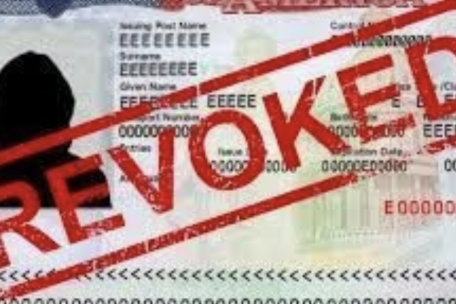 Image of a US visa with the word Revoked circled and written in red