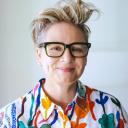 Professor Jacqueline Alderson of DataX wearing a very colorful floral shirt, smiling