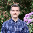 Drago Plecko, DataX affiliated faculty, wearing a plaid shirt in a garden.