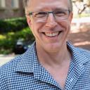 Chris Johanson in blue-checked shirt outside Murphy Hall.