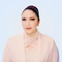 Francesca Albrezzi in front of a blank wall