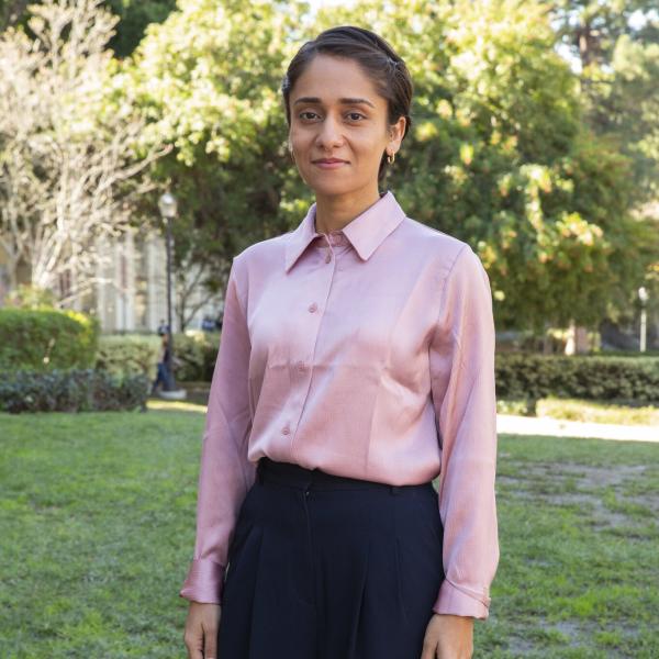 Noopur Raval, Assistant Professor, Department of Information Studies, in pink shirt and black pants