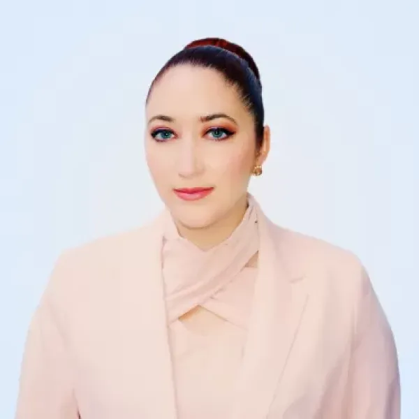 Francesca Albrezzi in front of a blank wall